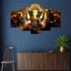 Decor Home Craft A Decor Home Ganesha 24x50in wall painting with intricate design hangs above a wooden cabinet in a living room with a dark blue wall, complemented by a wooden chair and a potted plant on the side.