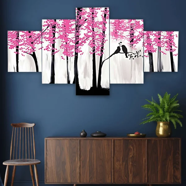 Decor Home Craft A Nature set of 5 framed 24x50" wall paintings depicting a stylized pink cherry blossom tree with a black silhouette of a bird perched on a branch, mounted on a deep blue wall above a wooden cabinet with a potted plant in an office.